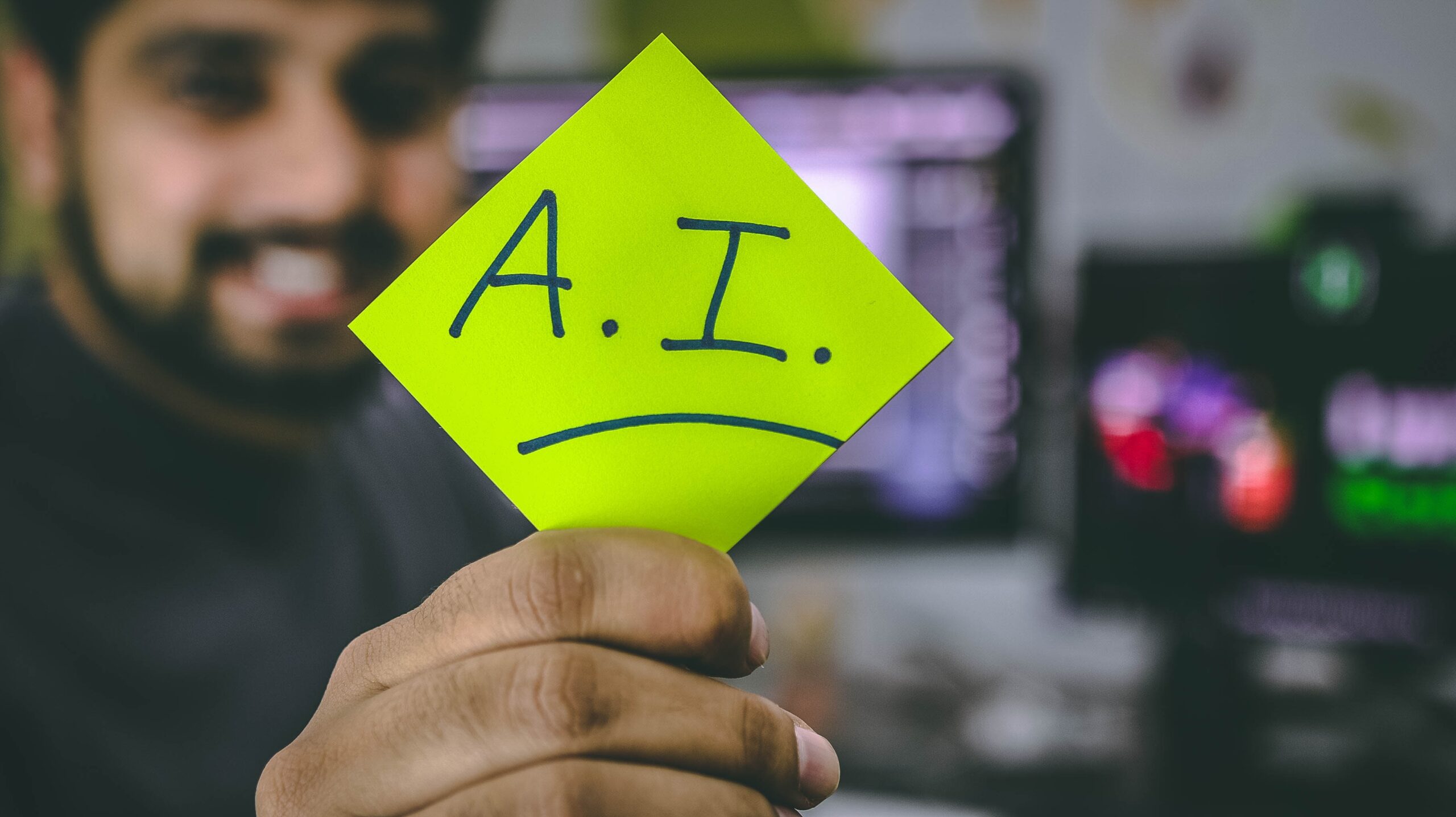 A person holding a paper in his hand showing the affection for Artificial Intelligence in marketing and maximizing the rise of Artificial Intelligence in Marketing.